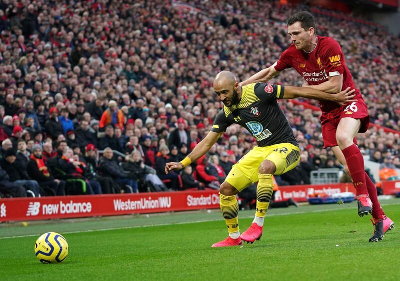 Liverpool's Andrew Robertson, right, challenges Southampton's Nathan Redmond at Anfield on Saturday. AP