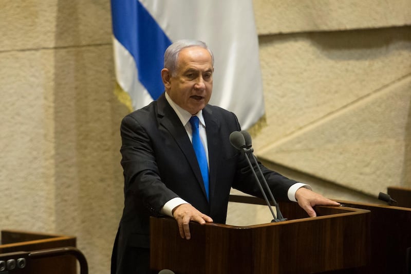 Mr Netanyahu speaks before parliament votes. Getty Images