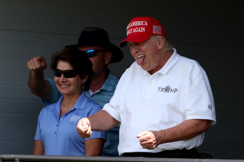 Mr Trump looks on from the 18th green during day two of the LIV Golf Invitational - DC. AFP