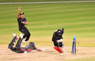 Basil Hameed was run out after adding a valuable 38 at the end of the UAE innings against Singapore. Courtesy ACC