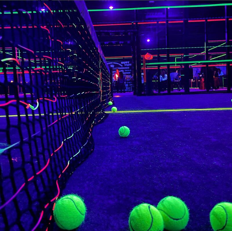 The Alley DXB is a glow-in-the-dark padel court in Dubai. Photo: @thealleydxb / Instagram 