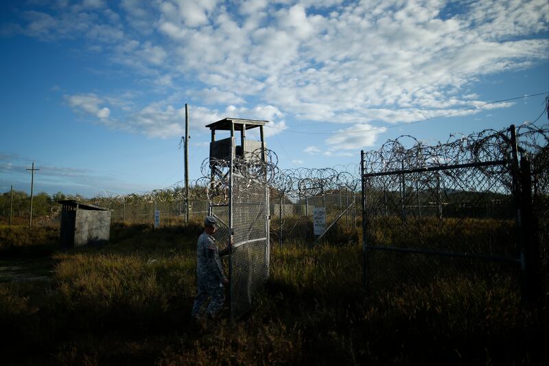 A soldier closes a gate at the now-abandoned Camp X-Ray at Guantanamo Bay, Cuba, which was used as the first detention facility for Al Qaeda and Taliban militants captured after the September 11 attacks.