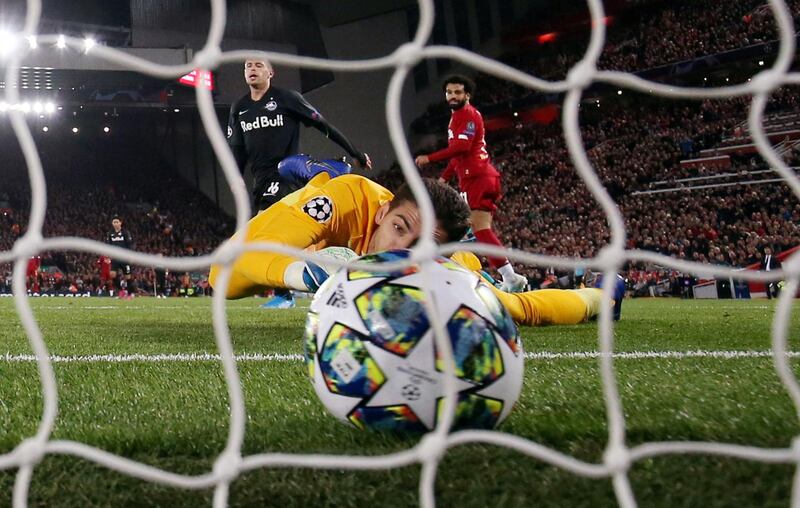 Salah scores their third goal past FC Salzburg's Cican Stankovic. Action Images via Reuters