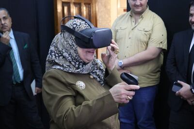 A visitor at Mosul Heritage Museum explores the city's destroyed ancient sites at the virtual reality exhibition. Photo: Mosul Heritage Museum