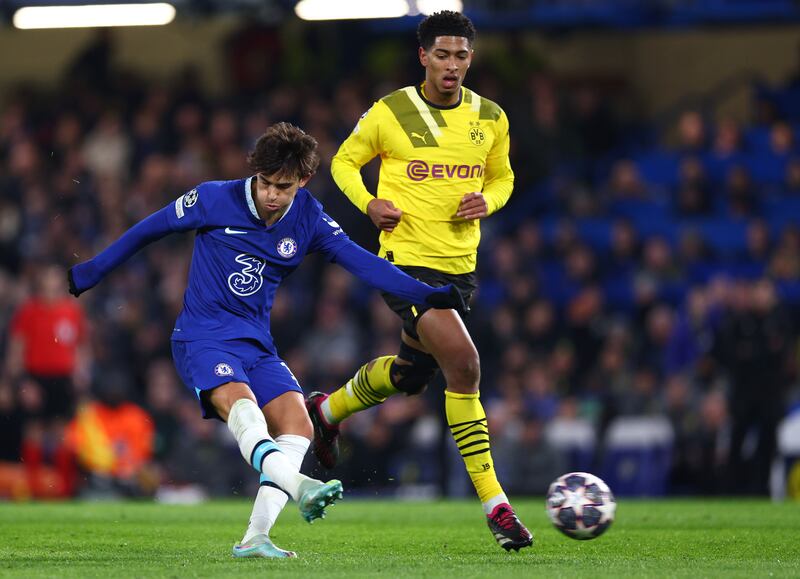 Joao Felix of Chelsea shoots under pressure from Jude Bellingham of Borussia Dortmund. Getty