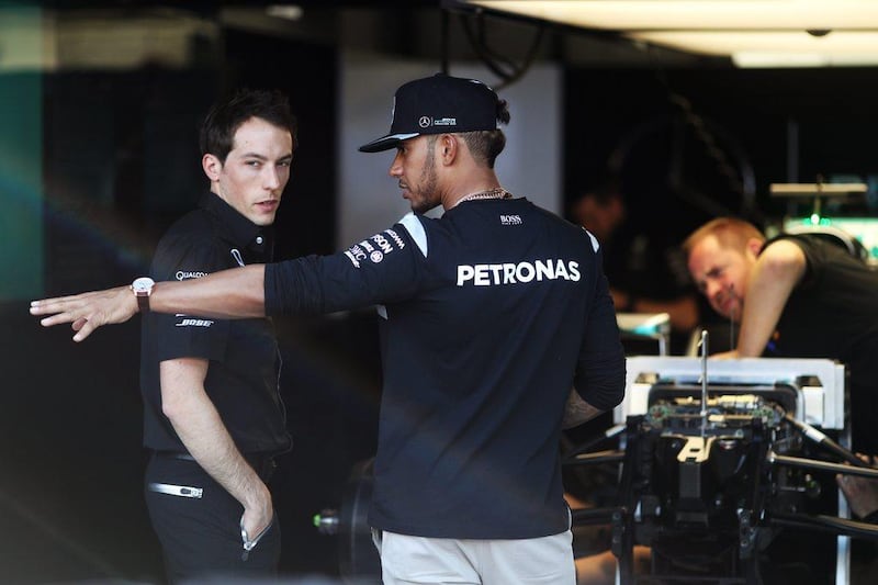 Lewis Hamilton, right, of Mercedes GP talks to a member of the team in the garage during previews to the Monaco Grand Prix at Circuit de Monaco on May 25, 2016 in Monte-Carlo, Monaco. Lars Baron/Getty Images