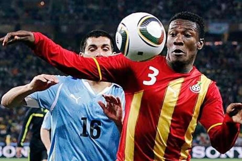 Asamoah Gyan, right, provided needed firepower for the Black Stars and showed his mental strength against Uruguay.