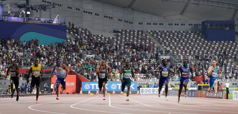 Christian Coleman, of the United States, third right, wins the gold medal in the men's 100m final ahead of Justin Gatlin of the United States, second right, silver, and Andre De Grasse, of Canada, fourth left, bronze, at the World Athletics Championships in Doha, Qatar, Saturday, Sept. 28, 2019. (AP Photo/Petr David Josek)
