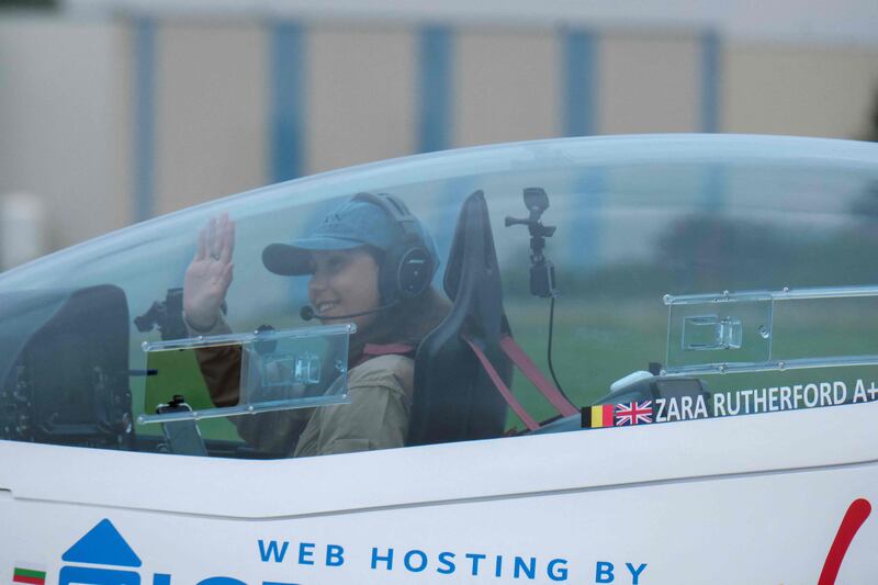 British-Belgian pilot Zara Rutherford waves before taking off for a round-the-world trip in a Shark ultralight, the world’s fastest light sport aircraft. AFP