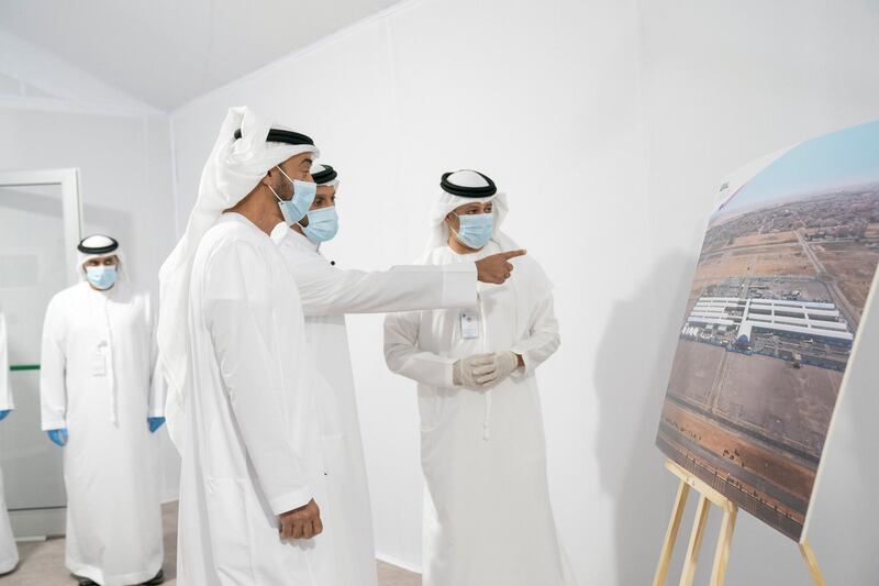 ABU DHABI, UNITED ARAB EMIRATES - May 18, 2020: HH Sheikh Mohamed bin Zayed Al Nahyan, Crown Prince of Abu Dhabi and Deputy Supreme Commander of the UAE Armed Forces (L) visits Emirates Field Hospital, at Emirates Humanitarian City. Seen with HE Sheikh Abdullah bin Mohammed Al Hamed, Chairman of the Department of Health - Abu Dhabi (C).

( Mohamed Al Hammadi / Ministry of Presidential Affairs )
---