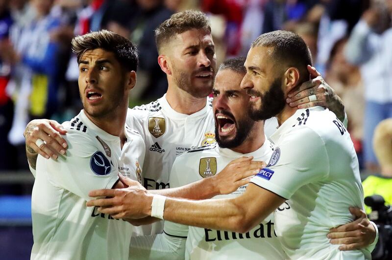 Benzema celebrates with teammates after scoring Madrid's first goal. Getty