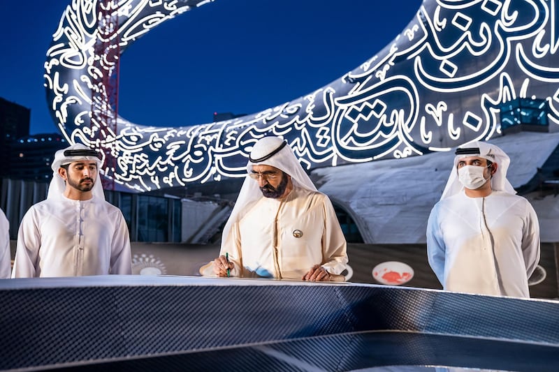 Sheikh Mohammed Bin Rashid, Vice-President and Prime Minister of the UAE and Ruler of Dubai, witnesses the installation of the final piece of façade of Museum of the Future. Seen with Sheikh Hamdan bin Mohammed bin Rashid Al Maktoum, Dubai Crown Prince and Chairman of The Executive Council of Dubai and Chairman of the Board of Trustees of Dubai Future Foundation; and Sheikh Maktoum bin Mohammed bin Rashid Al Maktoum, Deputy Ruler of Dubai. Courtesy Museum of the Future