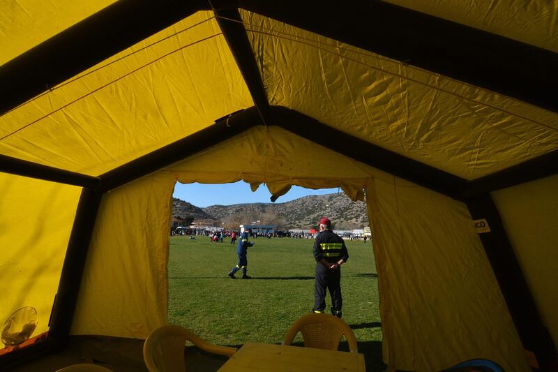 A civil protection tent is set up in a soccer field in Damasi. EPA