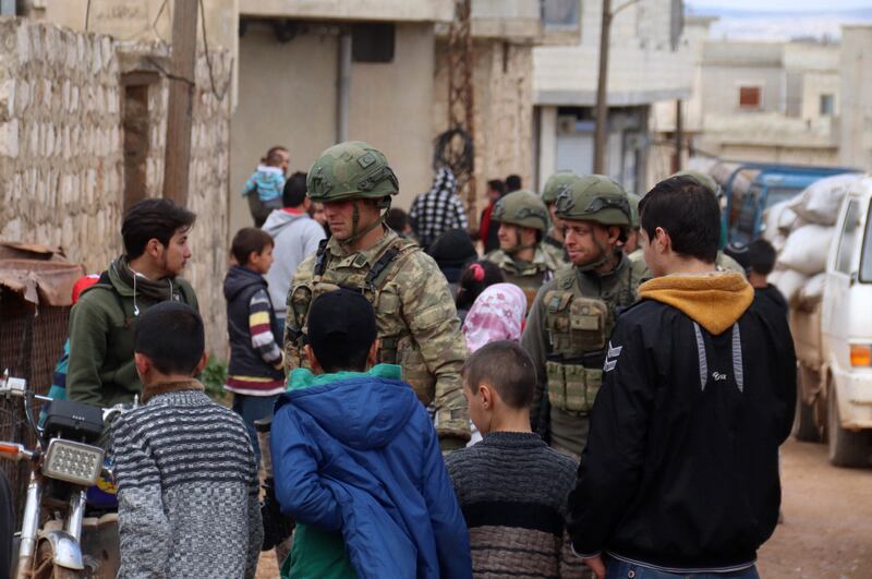 Turkish soldiers on patrol in the Syrian village of Ram Hamdan, north of the city of Idlib. All photos: AFP