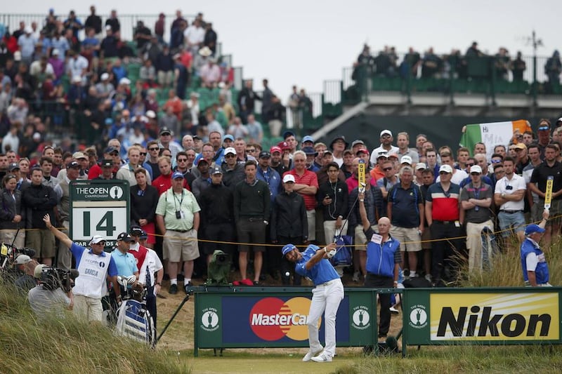 Dustin Johnson of the US watches his tee shot on the 14th hole during the final round of the British Open on Sunday. Cathal McNaughton / Reuters