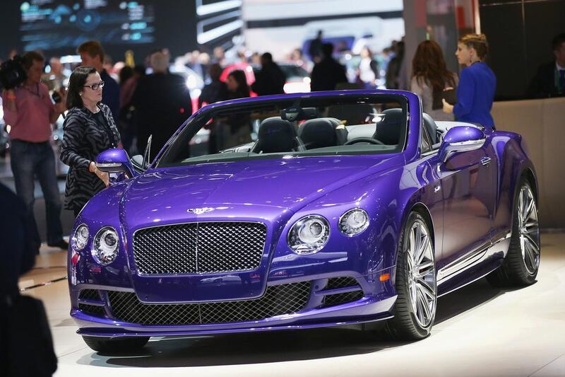 Bentley shows off their GTS Speed convertible at the North American International Auto Show in Detroit. The new Bentley GT Speed convertible reaches 203 mph while the coupe reaches a top speed of 206 mph – the fastest production Bentley ever. Scott Olson / Getty Images / AFP