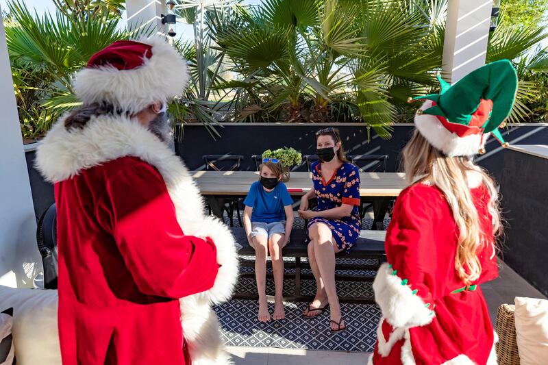 Dubai, United Arab Emirates - December 14, 2020: Lifestyle. Santa played by Keith Dallison. Santa is doing home visits with Covid-19 prevention measures in place and zoom calls to protect the children. Monday, December 14th, 2020 in Dubai. Chris Whiteoak / The National