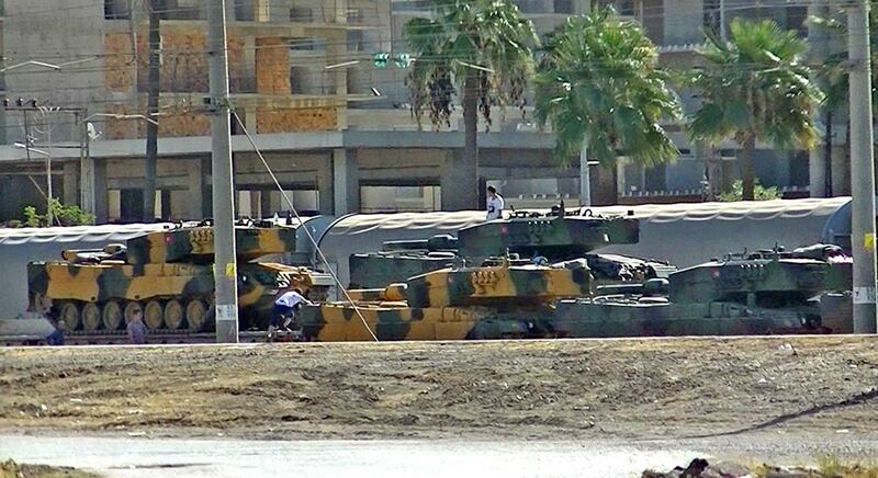 Turkish tanks are arriving at the Iskenderun train-port on October 7, 2017 at Iskendurun district in Hatay.
Turkish President Recep Tayyip Erdogan on October 7, 2017 said pro-Ankara Syrian rebels were staging a new military operation in Syria's jihadist-controlled Idlib province. / AFP PHOTO / DOGAN NEWS AGENCY / STRINGER / Turkey OUT