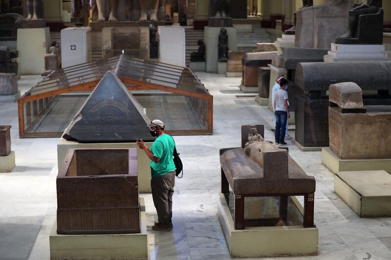 People visit the Museum of Egyptian Antiquities after it was reopened to visitors at Tahrir Square. EPA