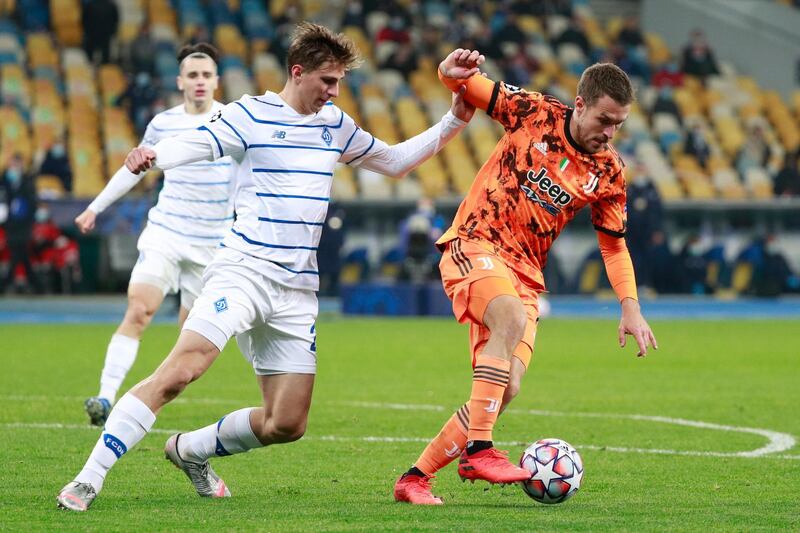Juventus midfielder Aaron Ramsey, right, under pressure form Dynamo Kiev's Illya Zabarnyi. AP