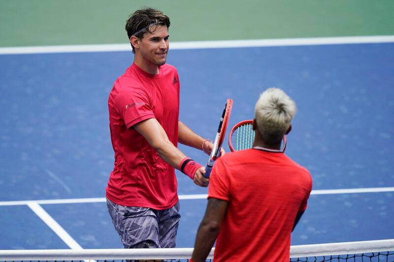 Dominic Thiem taps rackets with Sumit Nagal after winning their second round match of the US Open. AP Photo