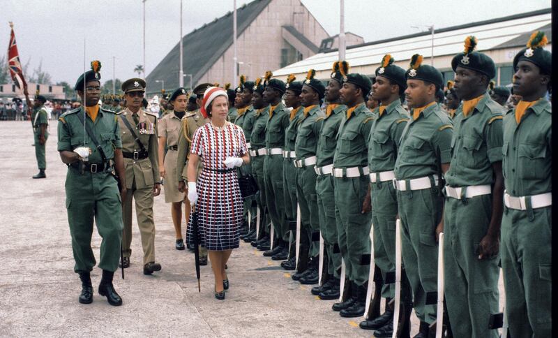 BARBADOS - OCTOBER 31:  Queen Elizabeth ll inspects a guard of honour as she arrives in Barbados on October 31, 1977 in Barbados. (Photo by Anwar Hussein/Getty Images)