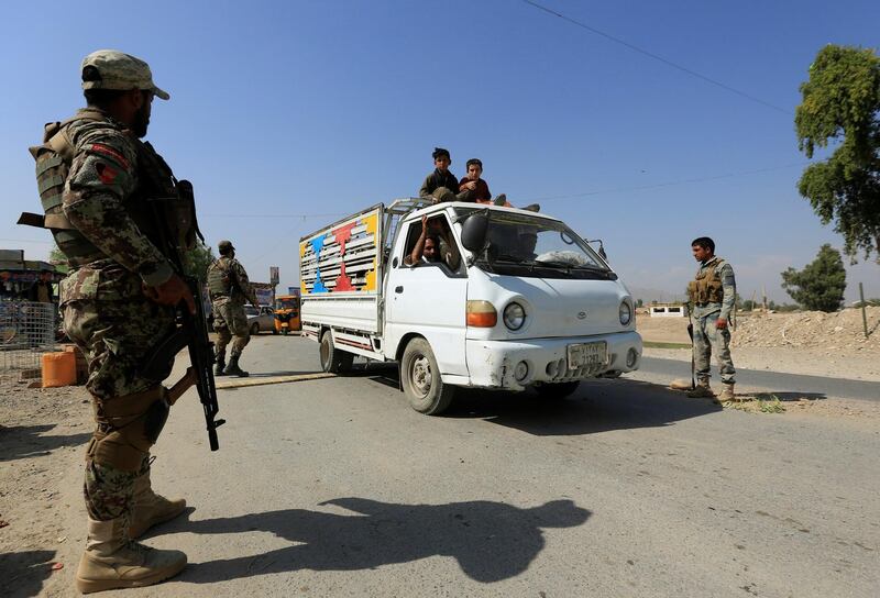 Security forces keep watch at a check point in Jalalabad city. Reuters