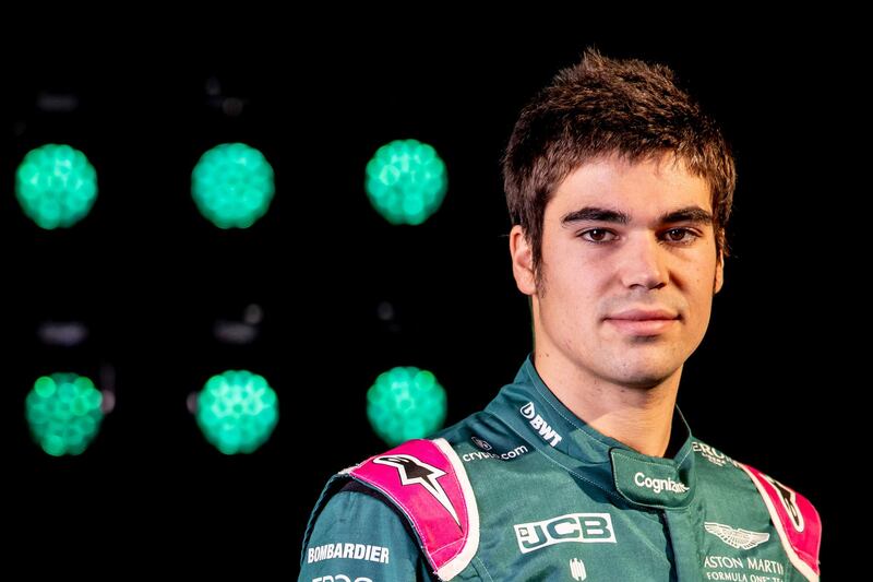 A handout photograph released by Aston Martin Cognizant Formula One Team on March 3, 2021 shows Belgian-Canadian driver Lance Stroll posing in front of the AMR21, their new car for the 2021 Formula One season, during a virtual launch event at their headquarters in Gaydon, central England.  RESTRICTED TO EDITORIAL USE - MANDATORY CREDIT "AFP PHOTO / ASTON MARTIN / GLENN DUNBAR" - NO MARKETING - NO ADVERTISING CAMPAIGNS - DISTRIBUTED AS A SERVICE TO CLIENTS
 / AFP / ASTON MARTIN / Glenn Dunbar / RESTRICTED TO EDITORIAL USE - MANDATORY CREDIT "AFP PHOTO / ASTON MARTIN / GLENN DUNBAR" - NO MARKETING - NO ADVERTISING CAMPAIGNS - DISTRIBUTED AS A SERVICE TO CLIENTS
