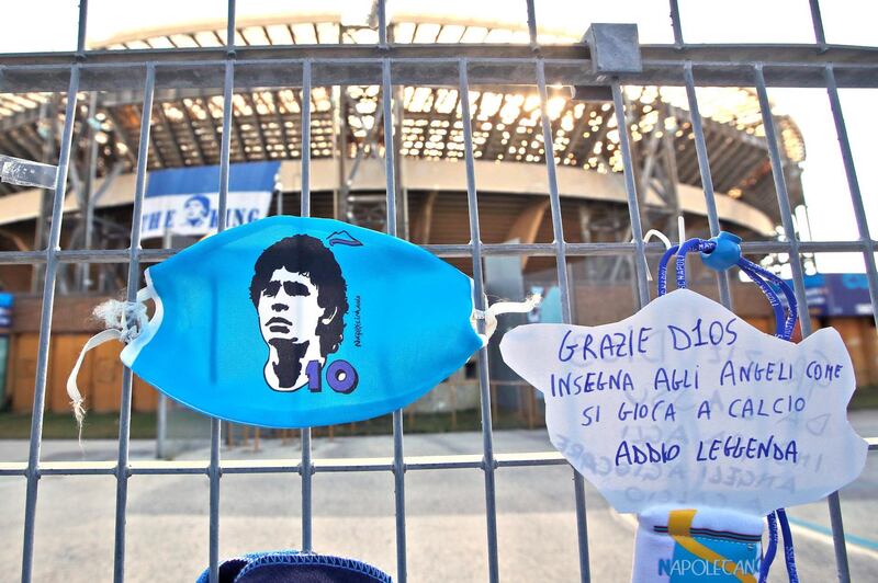 A sign reads "Thank you god, teach the angels how to play football, farewell legend" is seen on the gates of the San Paolo stadium in Naples. AP Photo