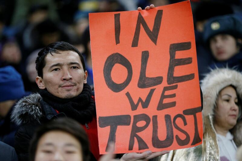 A fan displays a sign in reference to Manchester United manager Ole Gunnar Solskjaer before the Europa League match against Astana. Reuters