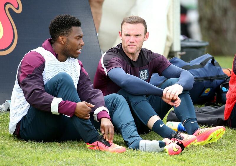 Daniel Sturridge and Wayne Rooney relax during England's World Cup 2014 training session on Wednesday. Richard Heathcote / Getty Images / May 21, 2014