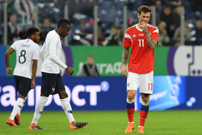 Russia's forward Fyodor Smolov reacts during an international friendly football match between Russia and France at the Saint Petersburg Stadium in Saint Petersburg on March 27, 2018. / AFP PHOTO / Kirill KUDRYAVTSEV