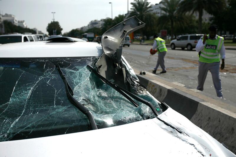 ABU DHABI, UNITED ARAB EMIRATES - February 8, 2009: Police clean up the scene of an accident, involving multiple cars at the corner of 15th Street and Airport Road in Abu Dhabi. 

( Ryan Carter/The National )