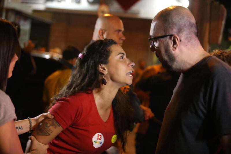 Supporters of Socialist candidate Fernando Haddad argue with supporters of Jair Bolsonaro in Rio de Janeiro. EPA