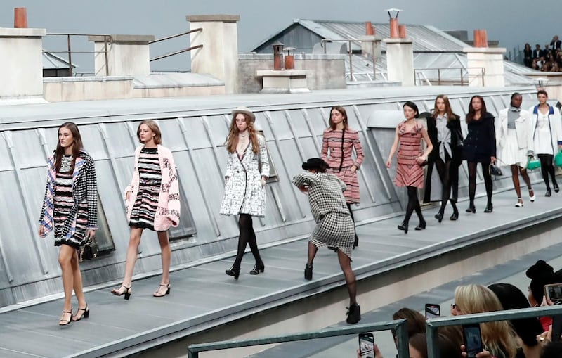 epa07885037 French comedian Marie Benoliel aka 'Marie Sâ€™Infiltre' (C) leaps onto the catwalk during the finale of the presentation of the Spring/Summer 2020 Women's collection by French designer Virginie Viard for Chanel fashion house during the Paris Fashion Week, in Paris, France, 01 October 2019. The presentation of the Women's collections runs from 23 September to 01 October.  EPA/IAN LANGSDON