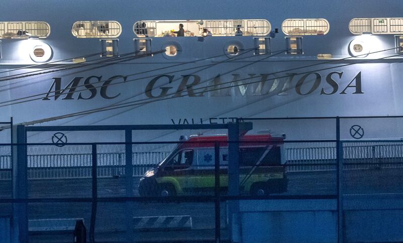 An ambulance near the 'MSC Grandiosa' cruise ship which docked in Genoa on Monday. EPA