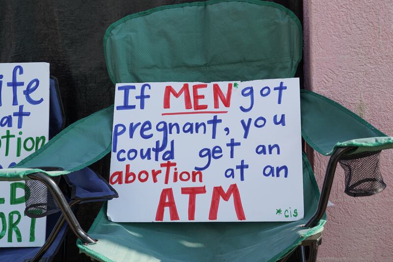 A sign outside the Jackson Women's Health Organisation reads: 'If men got pregnant, you could get an abortion at an ATM'. Willy Lowry / The National 