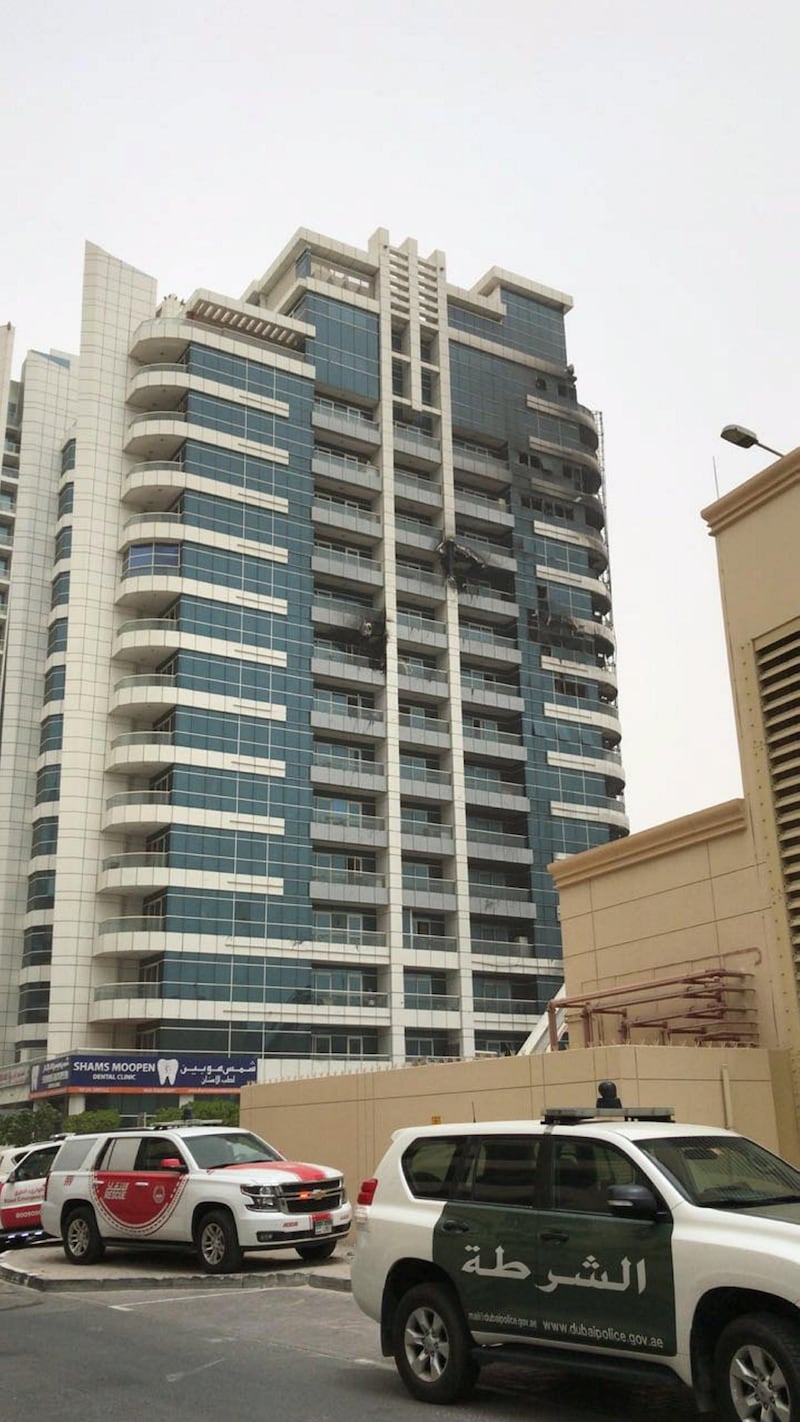 <p>Emergency services work to put out the fire at Zen Tower in Dubai Marina. 13 May 2018. Leslie Pableo for The National