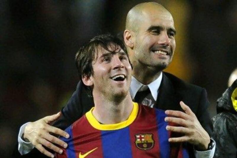 Barcelona's coach Josep Guardiola and Lionel Messi. JAVIER SORIANO / AFP