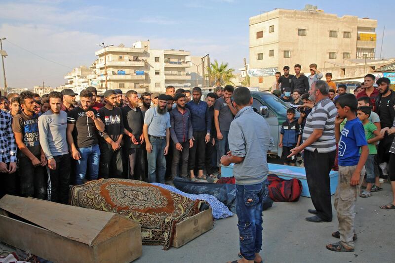 Syrians take part in the funeral of 10 fighters with the Turkey-backed Faylaq Al Sham rebel faction in Syria. AFP