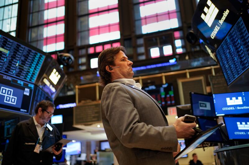 Traders work on the floor at the New York Stock Exchange on Friday. A dismal streak pushed Wall Street into a bear market last month as traders worry that inflation will be tough to beat and that a recession could be on the way as well. AP