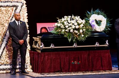 A man stands guard next to the casket for late rapper Marcel Theo Hall, known by his stage name Biz Markie, during the funeral service in Patchogue, New York, on August 2, 2021. Reuters