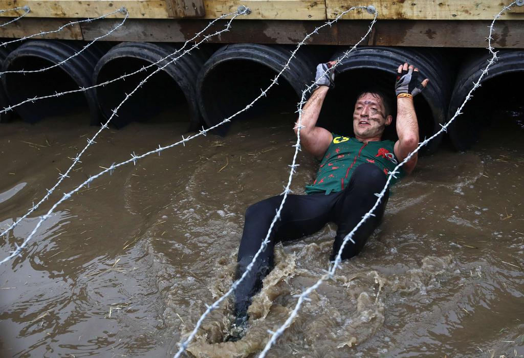 A competitor participates in the Tough Mudder challenge near Winchester in southern England on Saturday. Luke MacGregor / Reuters