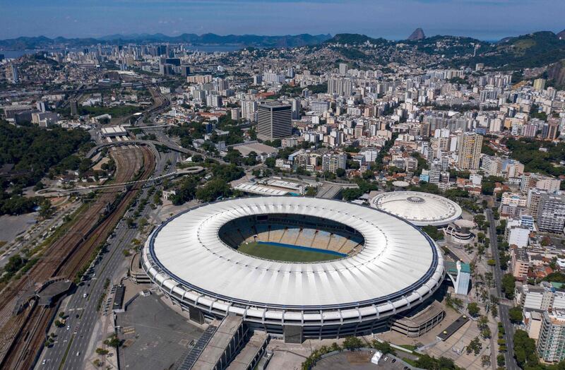 (FILES) In this file photo taken on April 02, 2020, aerial view of  Maracana stadium and Maracanazinho gym in Rio de Janeiro, Brazil.   The Legislative Assembly of Rio de Janeiro (Alerj) asked on April 6, 2021 to veto the bill it approved almost a month ago to rename the legendary Maracana stadium with the name Rei Pele, in homage to the Brazilian football idol. / AFP / MAURO PIMENTEL
