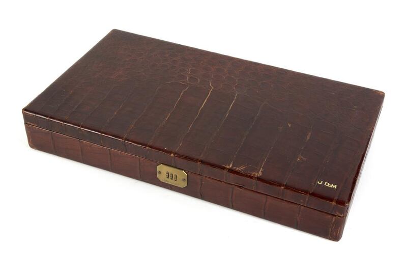 An alligator men’s accessory case, owned by Marilyn Monroe’s second husband, American baseball player, Joe DiMaggio, with monogrammed “JDim” on the bottom. The combination lock closure is set to 555, a nod to DiMaggio’s Yankee jersey number five. Courtesy Julien's Auctions