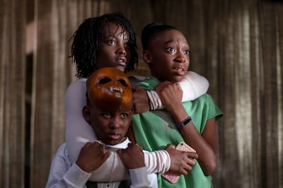 This image released by Universal Pictures shows, from left, Evan Alex, Lupita Nyong'o and Shahadi Wright Joseph in a scene from "Us," written, produced and directed by Jordan Peele. (Claudette Barius/Universal Pictures via AP)