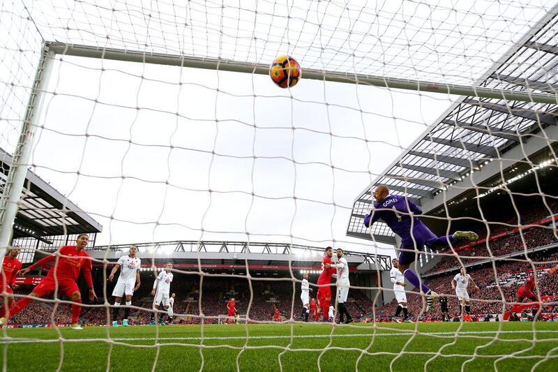 Heurelho Gomes of Watford attempts to save as Sadio Mane of Liverpool scores. Clive Brunskill / Getty Images