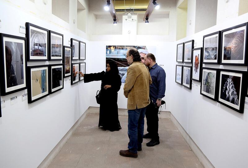 Dubai, March 20, 2018: Visitors take a look at the Photographs displayed by UAE photographers at the Sikka Art fair at Al Fahidi Historical District in Dubai. Satish Kumar for the National