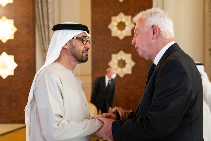 Panagiotis Pekraminos, the deputy prime minister of Greece, right, offers condolences to the President, Sheikh Mohamed.