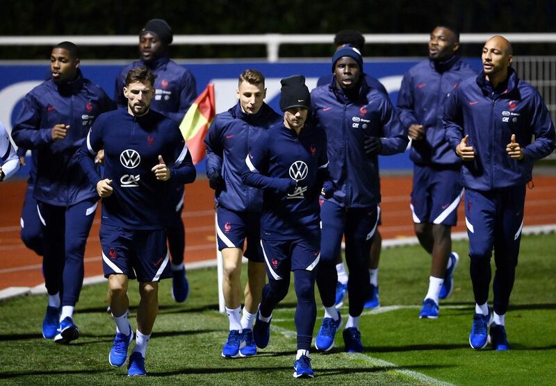 France player warming-up at training. AFP